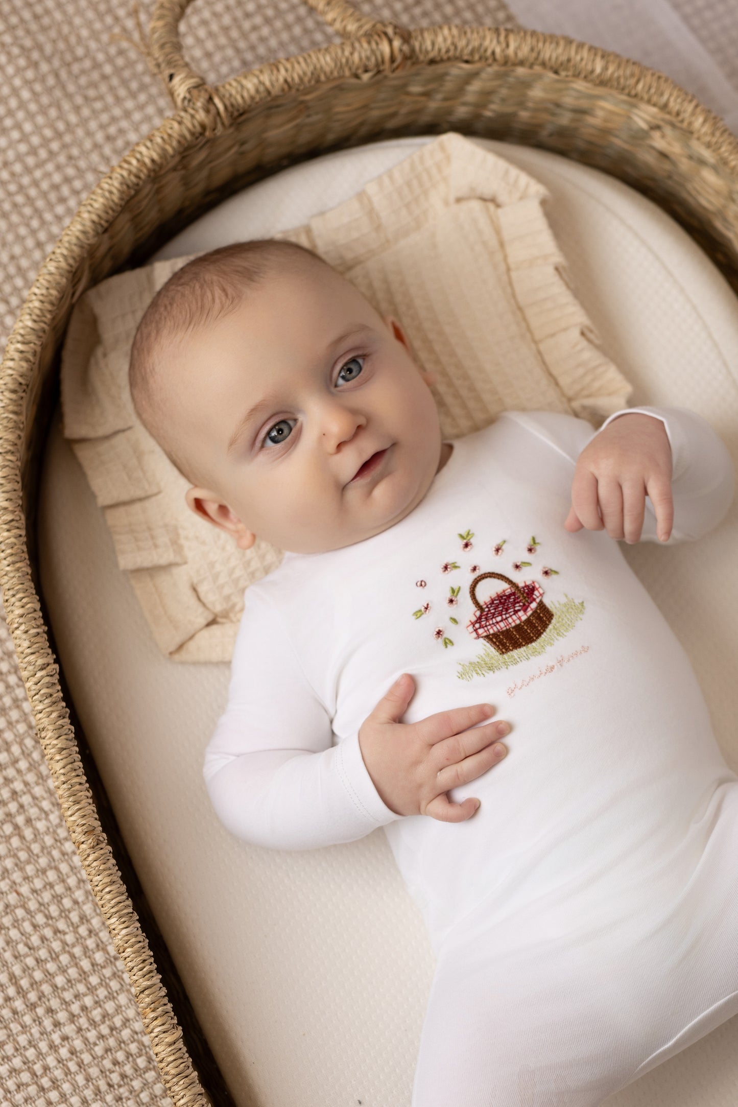 Picnic basket print baby footie in cotton-spandex, blue and red colorways