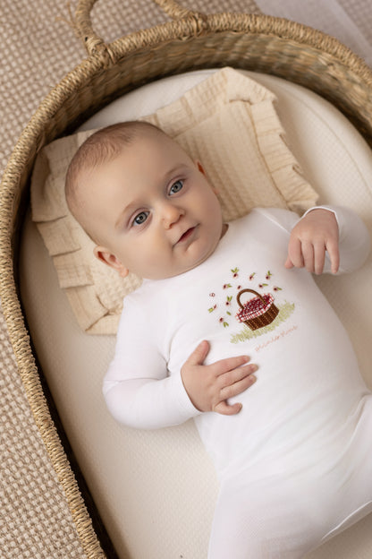 Picnic basket print baby footie in cotton-spandex, blue and red colorways