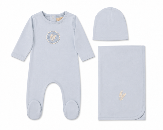 White cotton baby layette set with crochet appliqué detail and bonnet