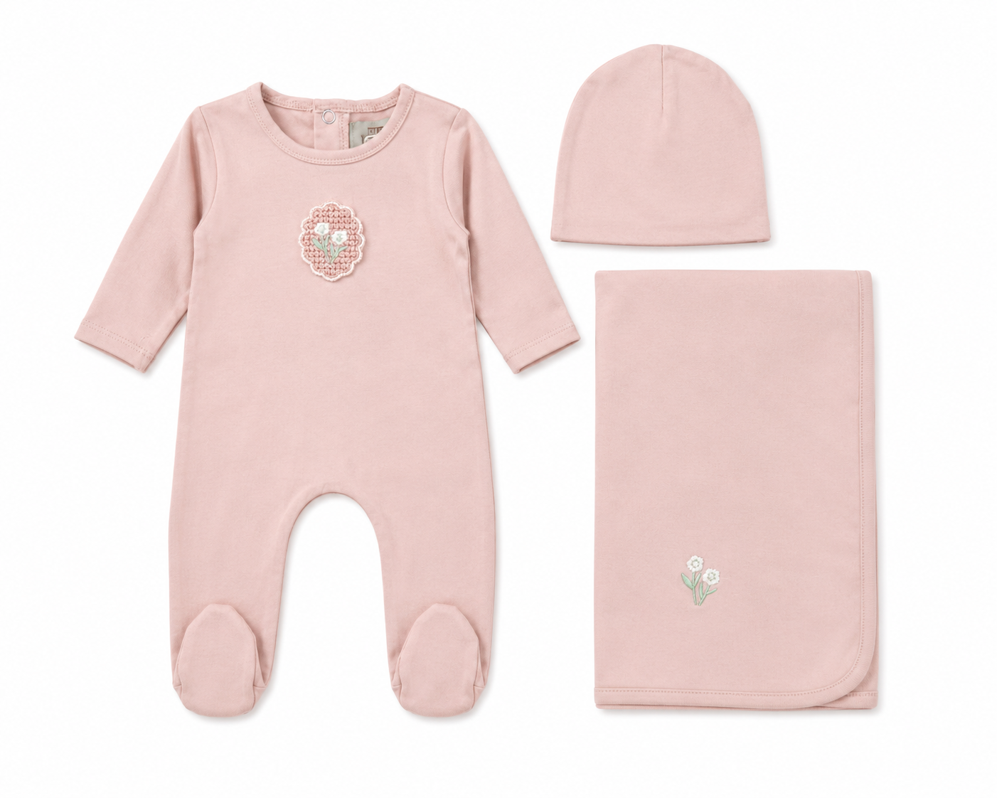 White cotton baby layette set with crochet appliqué detail and bonnet