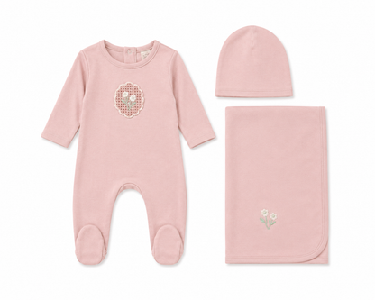 White cotton baby layette set with crochet appliqué detail and bonnet
