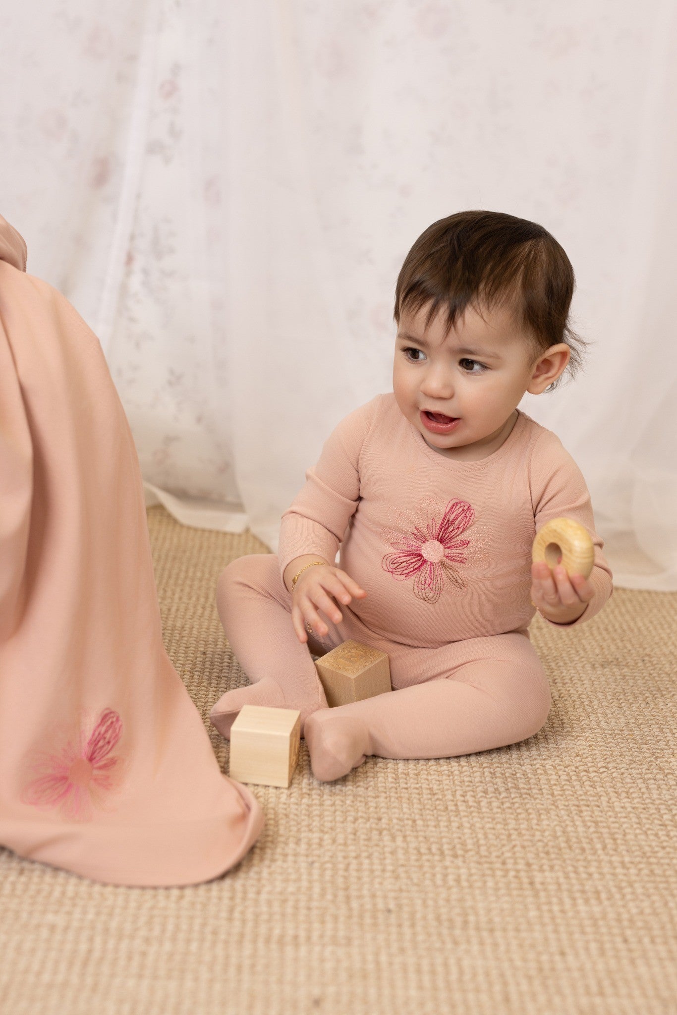 Hand-embroidered flower and star baby footie in cotton-spandex, 4 colors